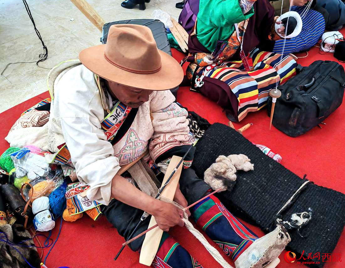 編織技能展示。人民網(wǎng) 李海霞攝